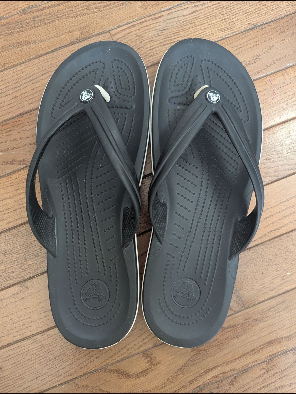 CROCS Black Flip Sandals with White Trim